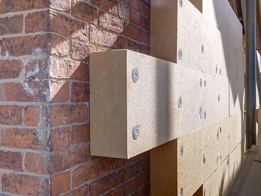 External wall insulation (EWI) being installed on a brick house – London retrofit coordination service